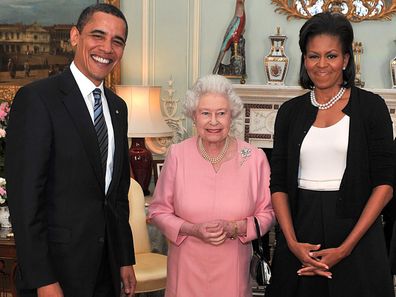 Barack Obama and his wife, Michelle Obama pose with Queen Elizabeth II at a reception at Buckingham Palace