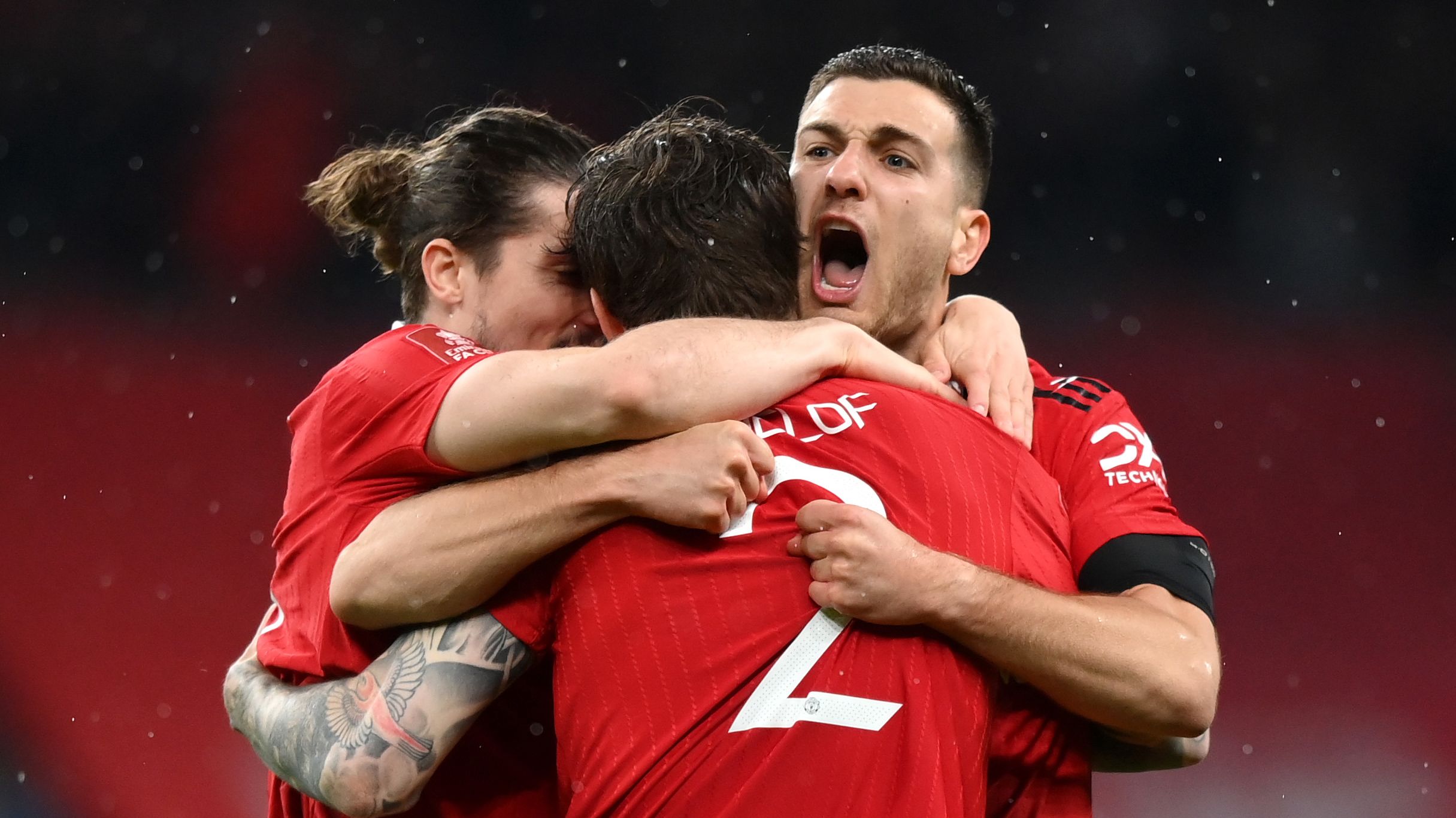 Diogo Dalot of Manchester United celebrates with Victor Lindelof of Manchester United after winning the penalty shootout in the Emirates FA Cup Semi Final match between Brighton &amp; Hove Albion v Manchester United at Wembley Stadium on April 23, 2023 in London, England. (Photo by Justin Setterfield - The FA/The FA via Getty Images)