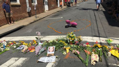 Flowers laid in tribute to Heather Heyer. (Lizzie Pearl)
