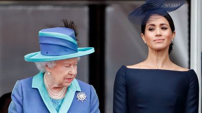 LONDON, UNITED KINGDOM - JULY 10: (EMBARGOED FOR PUBLICATION IN UK NEWSPAPERS UNTIL 24 HOURS AFTER CREATE DATE AND TIME) Queen Elizabeth II and Meghan, Duchess of Sussex watch a flypast to mark the centenary of the Royal Air Force from the balcony of Buckingham Palace on July 10, 2018 in London, England. The 100th birthday of the RAF, which was founded on on 1 April 1918, was marked with a centenary parade with the presentation of a new Queen's Colour and flypast of 100 aircraft over Buckingham 