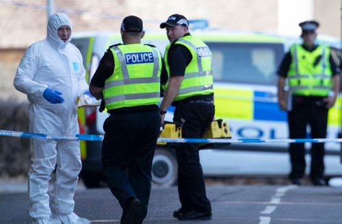 A file photo from last year of police officers on the Isle of Bute in Scotland, after the body of Alesha MacPhail was found.