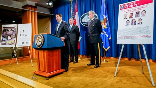 US Department of Justice assistant attorney general John Demers announces criminal charges against seven Russian Federation GRU intelligence officers in Washington, DC.