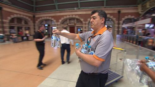 Transport staff spent the afternoon handing out complimentary bottles of water to commuters sweating it out on the train network.