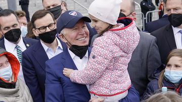 President Joe Biden meets with Ukrainian refugees during a visit to PGE Narodowy Stadium, Saturday, in Warsaw. 