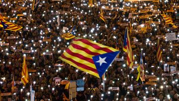 Demonstrators gather during a protest calling for the release of Catalan jailed politicians, in Barcelona (AP Photo/Emilio Morenatti)