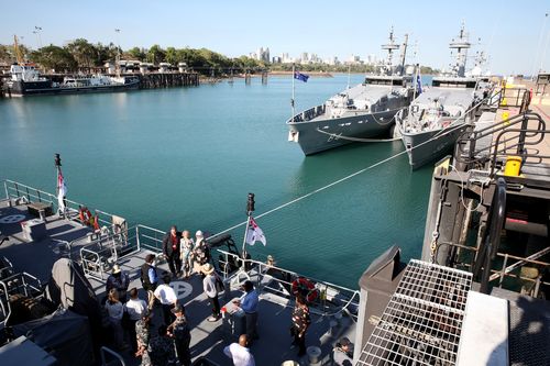 Mrs Bishop has pictures taken with delegates onboard HMS Maitland, an Armadale class patrol boat stationed at HMAS Coonawarra station in Darwin. Picture: AAP