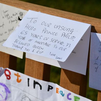 Tributes left for Prince Philip outside various palaces have been moved to Marlborough House Gardens by Royal Parks staff