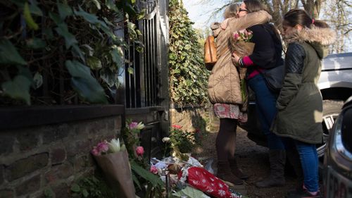 George Michael fans outside his London home, as the pop superstar has died at the age of 53 from suspected heart failure. (AAP)