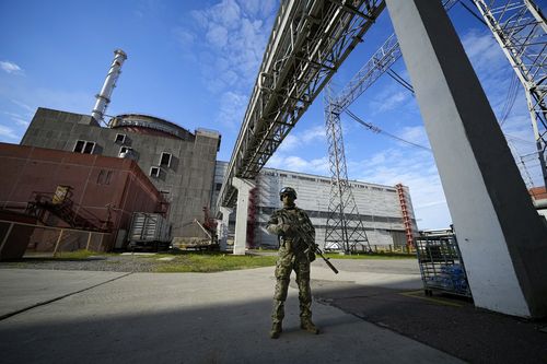 A Russian serviceman guards in an area of the Zaporizhzhia Nuclear Power Station in territory under Russian military control, southeastern Ukraine, on May 1, 2022. 