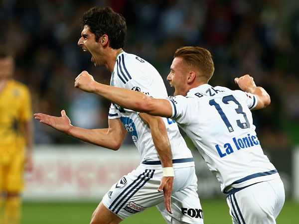 Victory midfielder Gui Finkler celebrates with teammates after scoring a goal during Melbourne's win over Central Coast Mariners. (Getty)