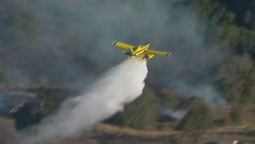 Firefighters are working to bring a major fire under control west of the Gold Coast.