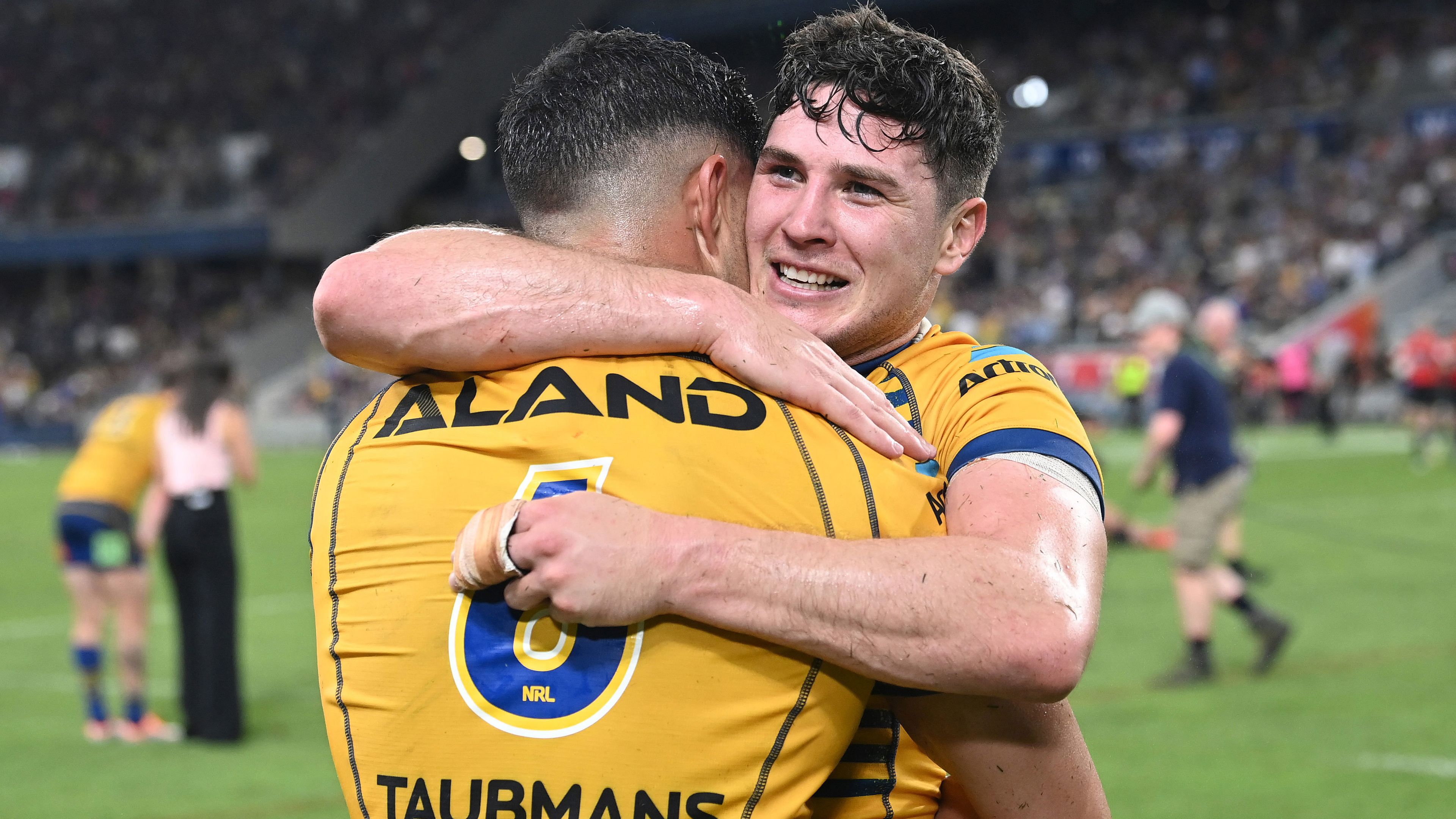 Eels star Mitchell Moses embraces Dylan Brown in their preliminary final win over the North Queensland Cowboys.