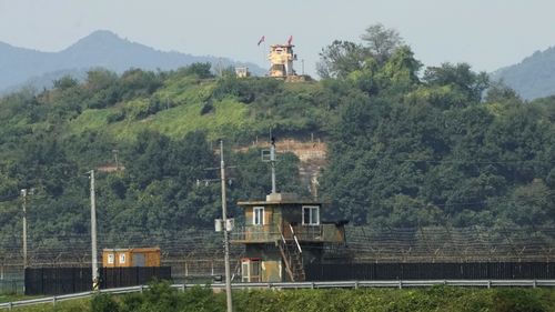 Military guard posts of North Korea, rear, and South Korea, bottom, are seen in Paju, near the border. 