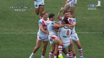 The Dragons celebrate a Francis Molo try against the Roosters.