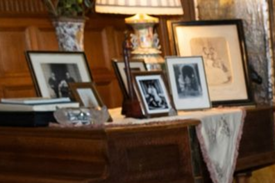 A closer look at the family photos sitting atop King Charles' piano