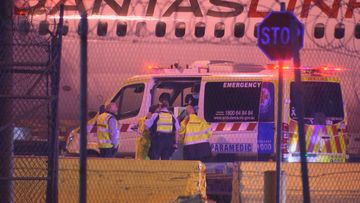 A Qantas crew member has been taken to hospital after a plane landed in Melbourne overnight.