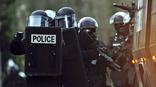 French police officers patrol in Longpont, north of Paris, in search of the Charlie Hedbo gunmen. (AAP)