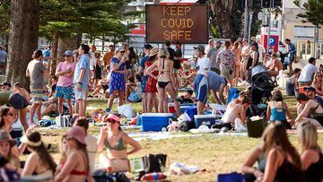 People in Sydney gather at a beach in Manly, on the city&#x27;s north shore.