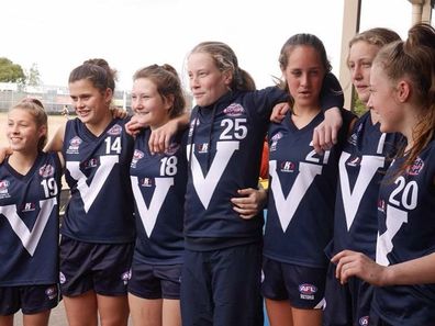 AFLW player Nell Morris-Dalton with her footy team as a teenager.