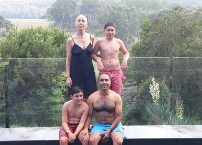 Yoav and Elaine with their boys swimming