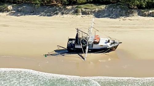A fishing trawler has been beached on a Gold Coast beach following rough waves yesterday. 