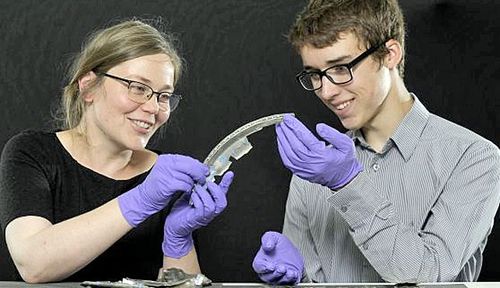 David Hall examines the Roman silver he found with Alice Blackwell of National Museums Scotland. (Photo: Supplied).
