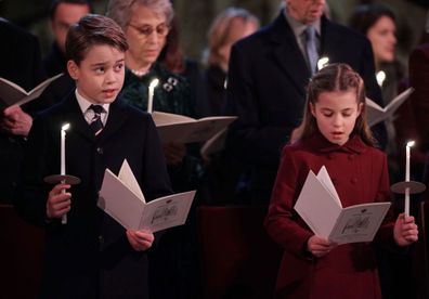 LONDON, ENGLAND - DECEMBER 15: In this photo released on December 24, Prince George and Princess Charlotte are seen during the 'Together at Christmas' Carol Service at Westminster Abbey on December 15, 2022 in London, England.  The service will be broadcast on ITV1 on Christmas Eve as part of a Royal Carols: Together At Christmas programme, narrated by Catherine Zeta Jones and featuring an introduction by Catherine, Princess of Wales and tributes to Queen Elizabeth II. (Photo Yui Mok - Pool/Gett