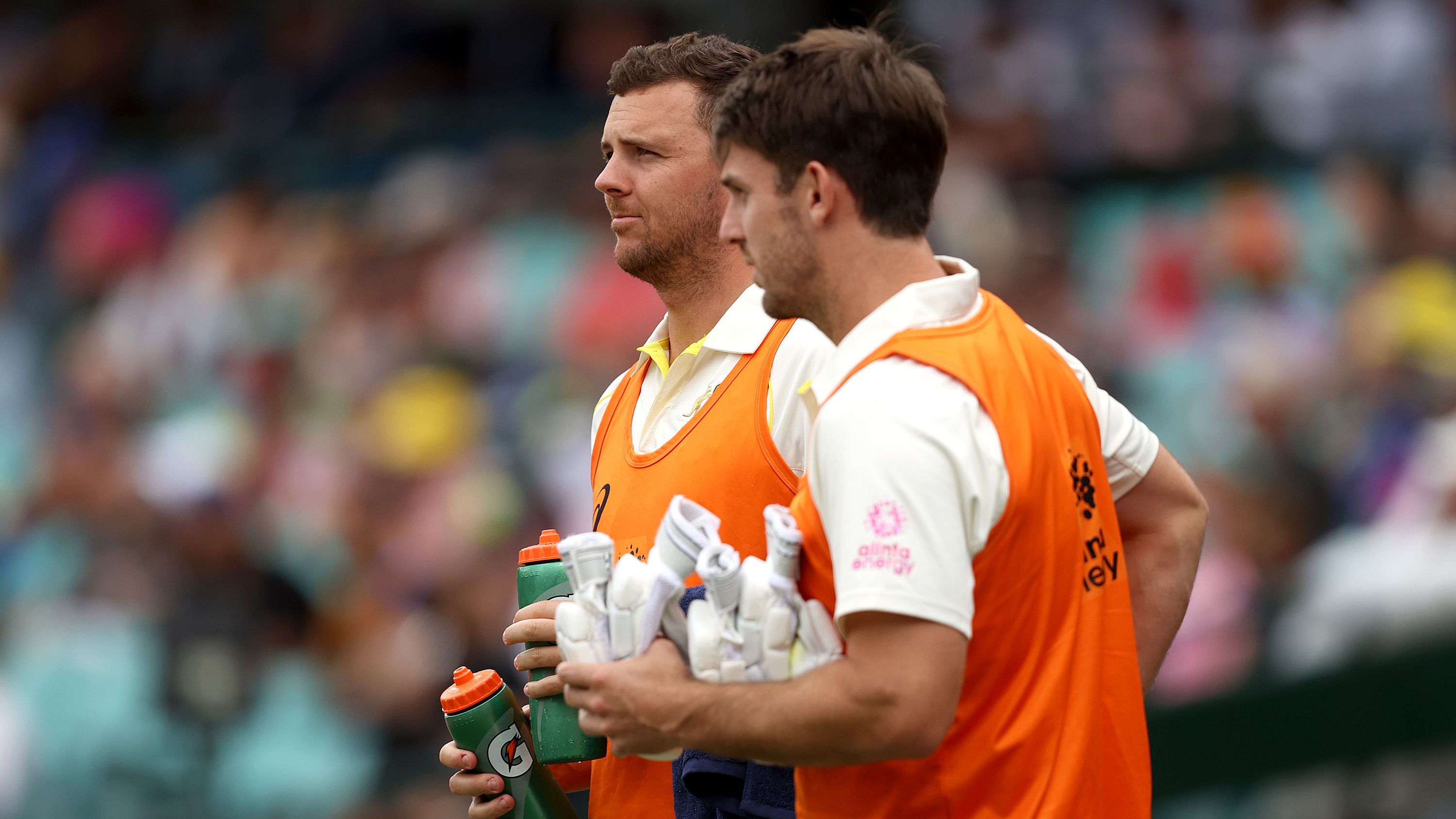 Josh Hazlewood and Mitchell Marsh running water during day one of the Fourth Test Match in the Ashes series.