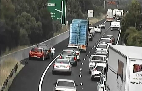 CCTV captured this driver actually get out of their car, dangerously close to passing traffic after another car ran up the back of them.