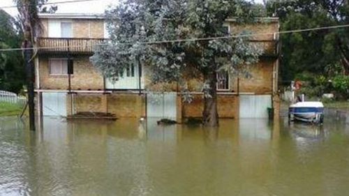 A home in Milperra remains partly underwater after the Georges River broke its banks. (Supplied)
