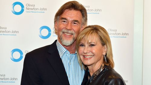 Newton-John with her husband John Easterling. (AAP)