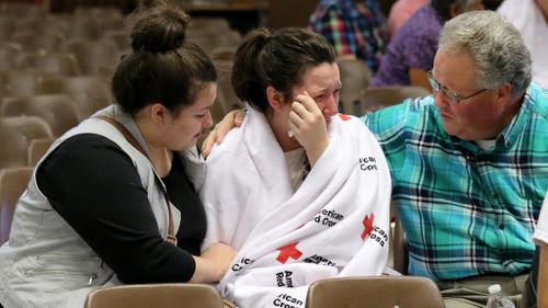 A family reunites after the shooting at Umpqua Community College. (AAP0