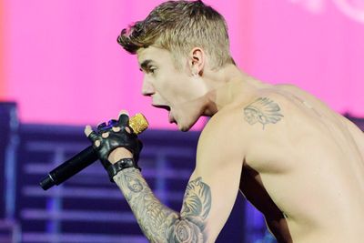 July 2013: Justin appeared to be spitting on fans from his hotel room in Toronto. His people denied it and claimed he bought the fans 'hot chocolate' and played some of his new music to them. Perhaps there was hot chocolate in the spit?<br/><br/>Image: Getty