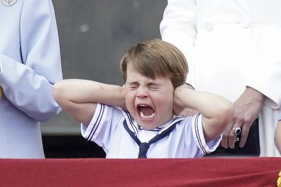 Prince Louis covers his ears from the balcony of Buckingham Place during a fly-past after the Trooping the Color ceremony in London, Thursday, June 2, 2022, on the first of four days of celebrations to mark the Platinum Jubilee. The events over a long holiday weekend in the U.K. are meant to celebrate the monarch's 70 years of service.