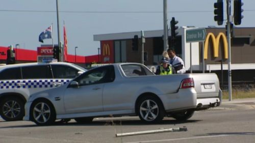 The silver ute slammed into eight people. (9NEWS)