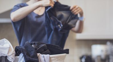 woman folding laundry