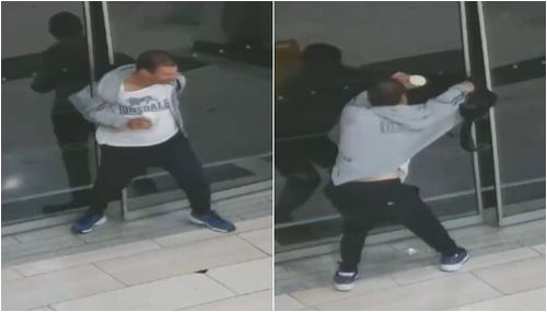 After getting his leg out from the glass, the thug tries to pull his back through the doors. (Supplied)