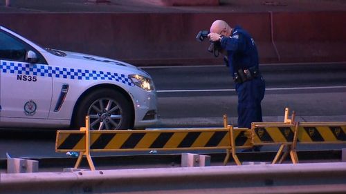 Forensics are on scene taking photographs. Picture: 9NEWS