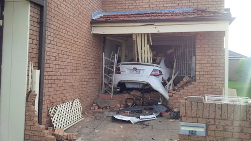 Two people have been injured after a car crashed into a house in Sydney's south. (Supplied)
