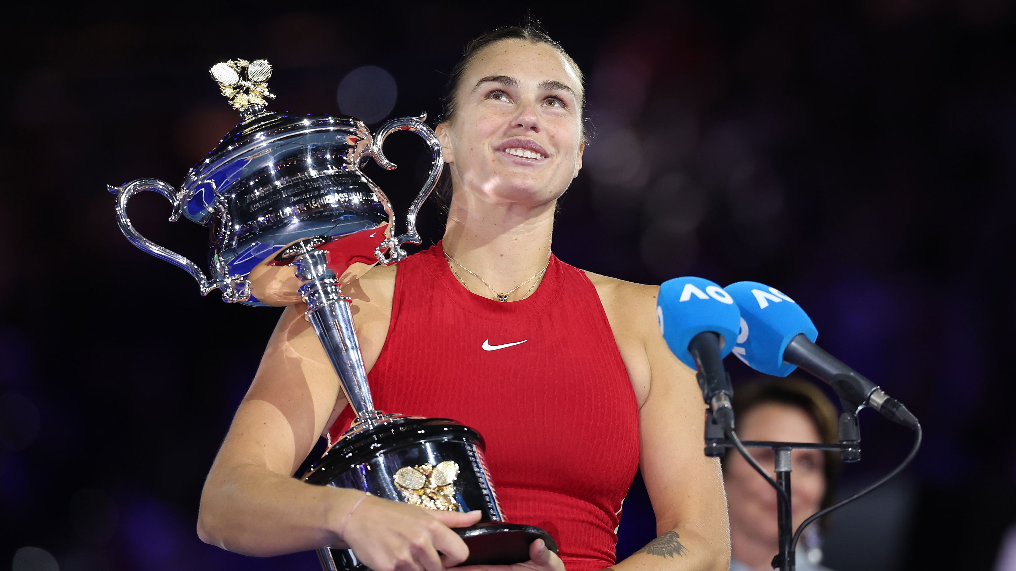 MELBOURNE, AUSTRALIA - JANUARY 27: Aryna Sabalenka holds the Daphne Akhurst Memorial Cup during the official presentation after the the Women&#x27;s Singles Final match between Qinwen Zheng of China and Aryna Sabalenka during the 2024 Australian Open at Melbourne Park on January 27, 2024 in Melbourne, Australia. (Photo by Cameron Spencer/Getty Images)