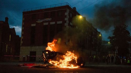 A police car is set on fire in Sunderland, England on August 2.