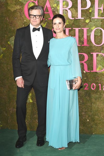 Colin Firth with wife Livia Firth. Livia wears a gown by family-owned Italian fashion house Laura Biagiotti.