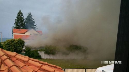 Neighbours said the smoke and flames were "intense". (9NEWS)