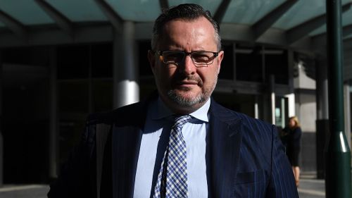 Queensland lawyer Adam Magill will stay in jail for allegedly breaching his bail conditions by contacting a lawyer in a corruption case against him.