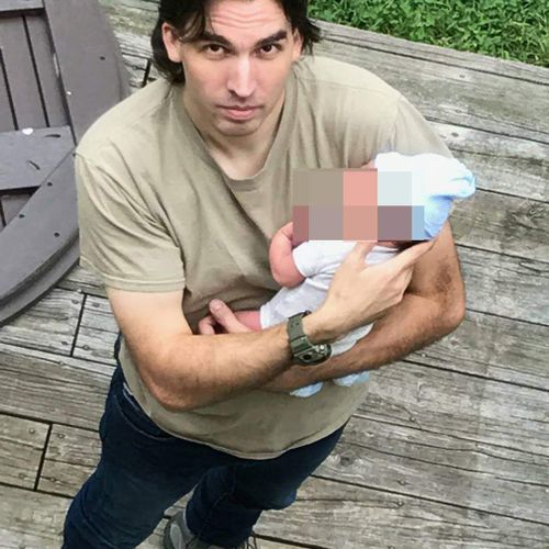 Steven Pladl is pictured with his infant son. (Facebook)