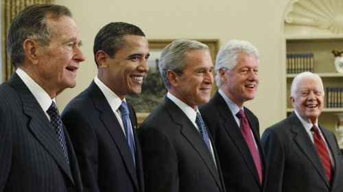 President George W. Bush, centre, with President-elect Barack Obama, second left, and former presidents, George H.W. Bush, left, Bill Clinton, second right, and Jimmy Carter, right, in the Oval Office in 2009.