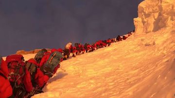 Climbers line up and wait on K2&#x27;s bottleneck couloir.