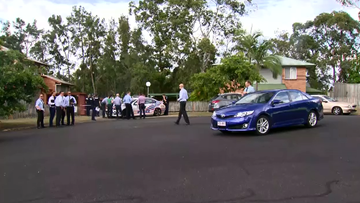 A crime scene is established at a housing commission building in Wishart, in Brisbane's southeast after a man was fatally stabbed.
