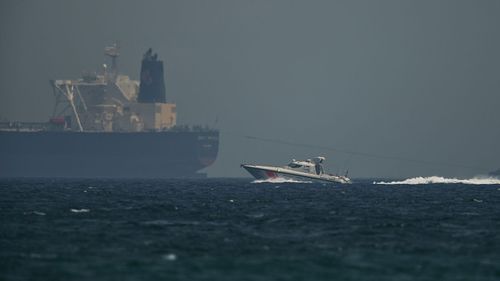 An Emirati coast guard vessel passes an oil tanker off the coast of Fujairah, United Arab Emirates. Saudi Arabia said two of its oil tankers were sabotaged off the coast of the United Arab Emirates near Fujairah in attacks that caused "significant damage" to the vessels.