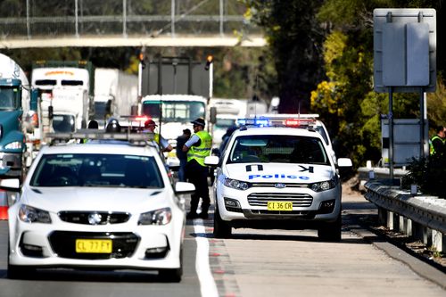 NSW Police establish a crime scene on the M1 Highway. Picture: AAP